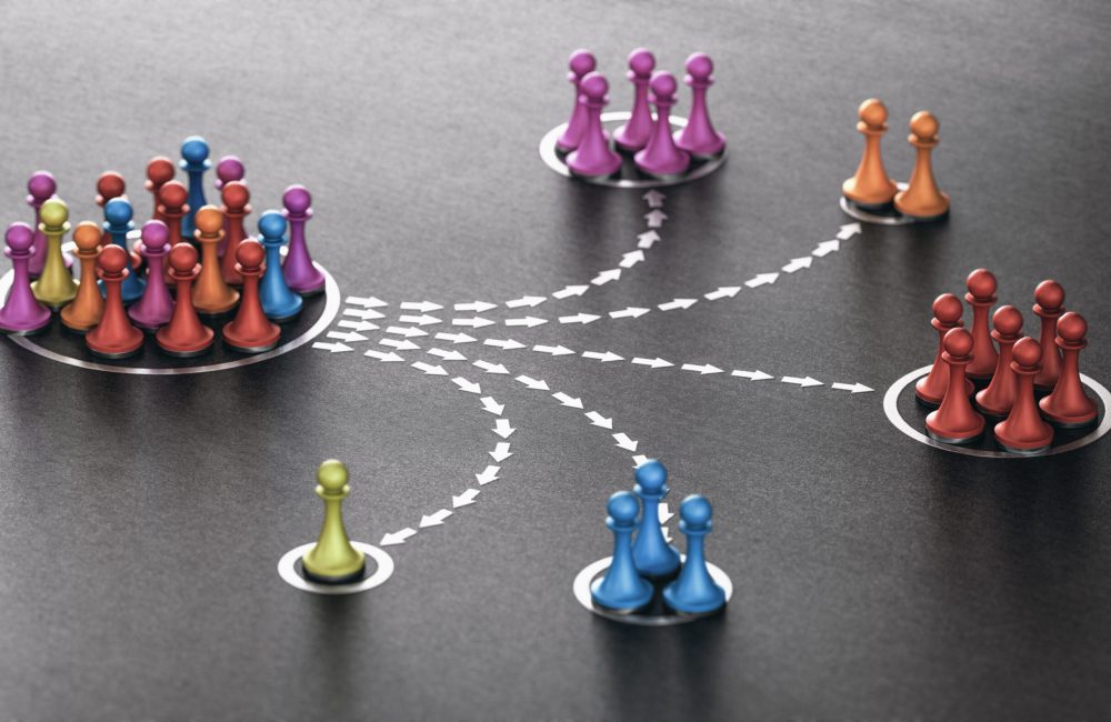 3D illustration of many pawns segmented in different categories over black background. concept of customer segmentation.